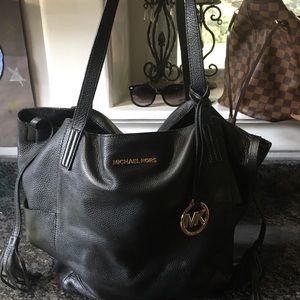 Authentic Michael Kors black leather bag.